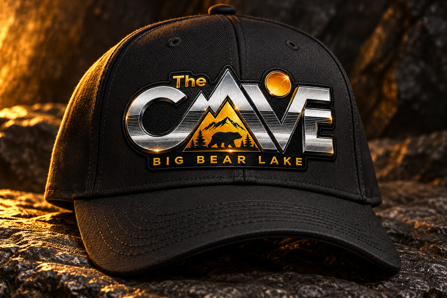 Black hats with The Cave logo on a rock surface, concept image
